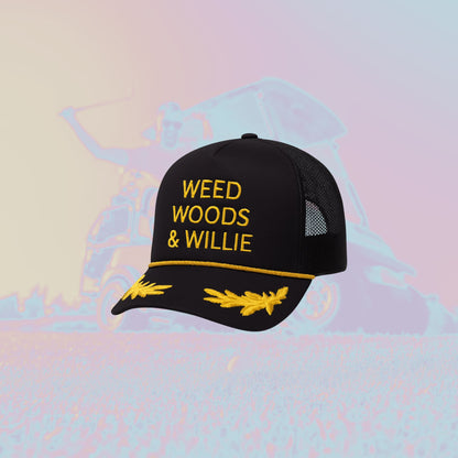 Black cap with yellow text 'WEED WOODS & WILLIE' on a colorful abstract background